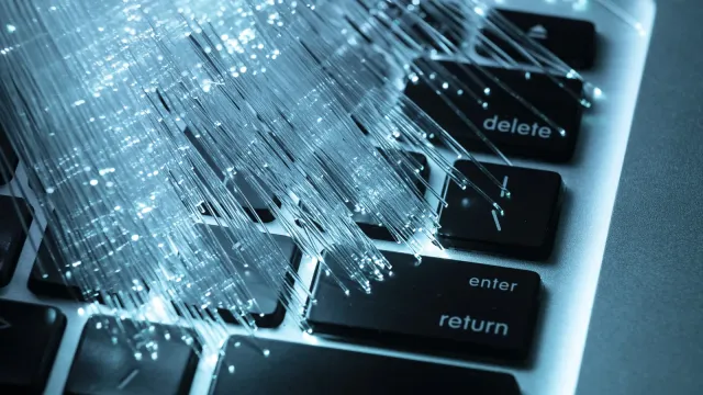 blue-optic-fiber-with-laptop-11382405.webp