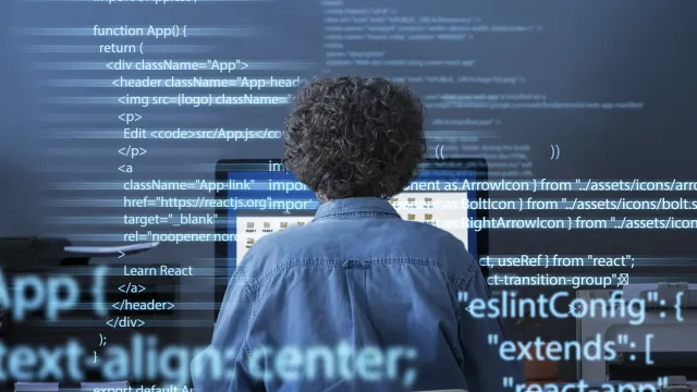 programming-background-with-person-working-with-codes-computer-38669454.webp